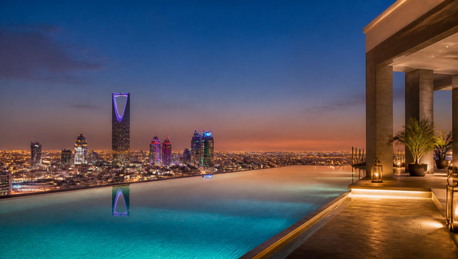 Modern villa swimming pool built by NOVIQ Pools in Saudi Arabia at sunset